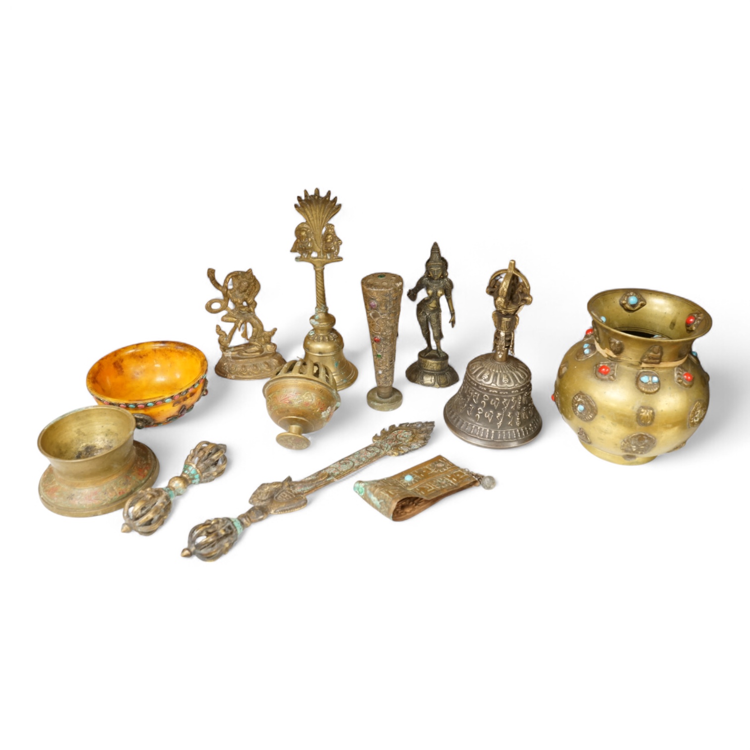 A group of Tibetan brass and mixed metal artefacts to include a brass vase with cabochon inset stones and figures of deities, largest 22cm high